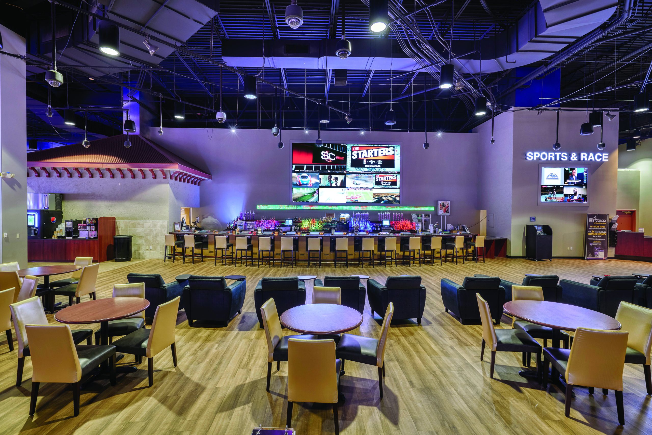 – Interior shot of Mardi Gras Casino and Resort, slot machines